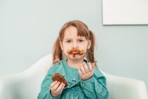 baby eating chocolate